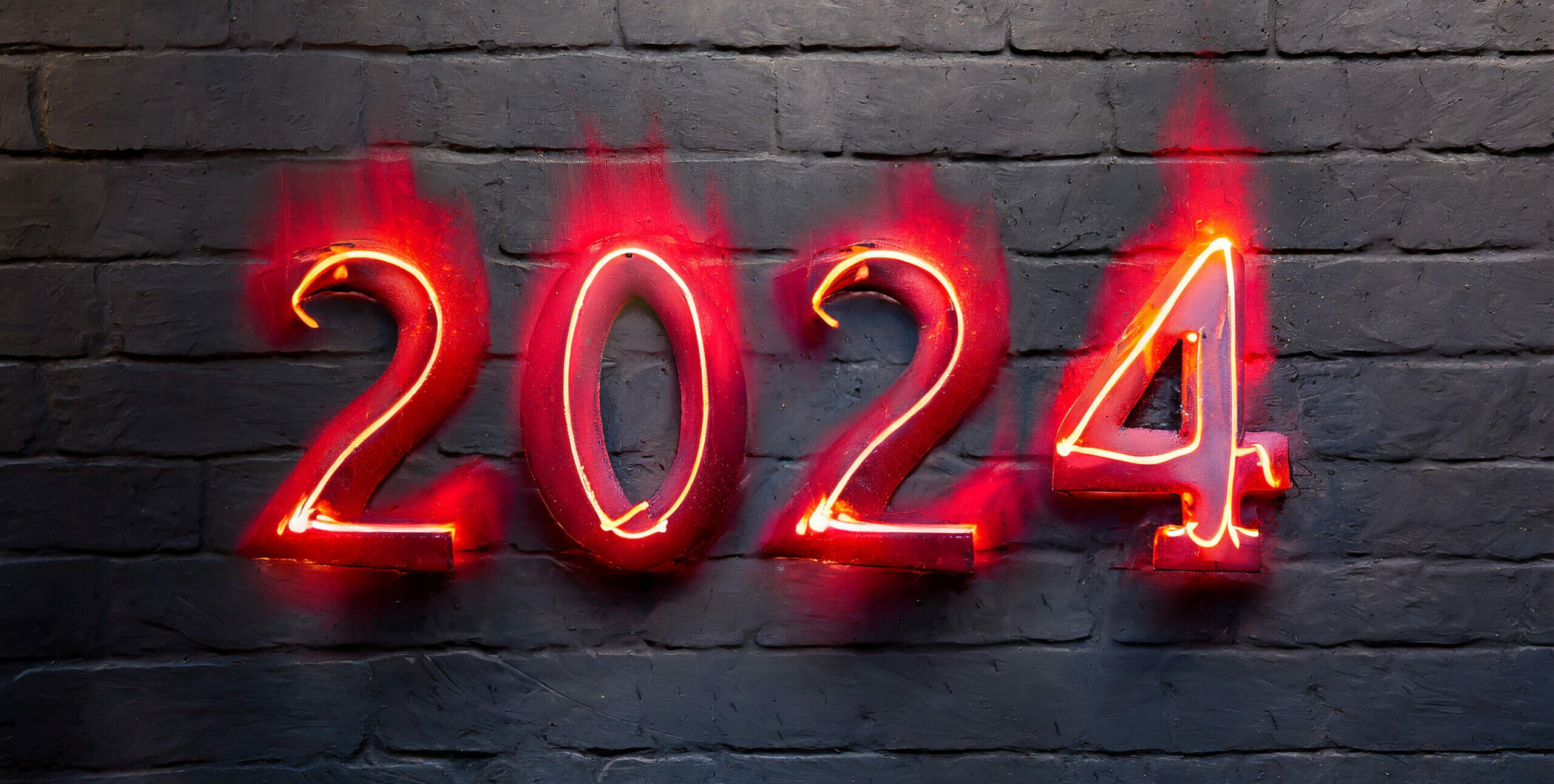 Le nombre 2024 peint en rouge sur un mur noir. Effet de flammes